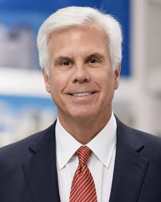 Headshot portrait of George E. Norcross III
